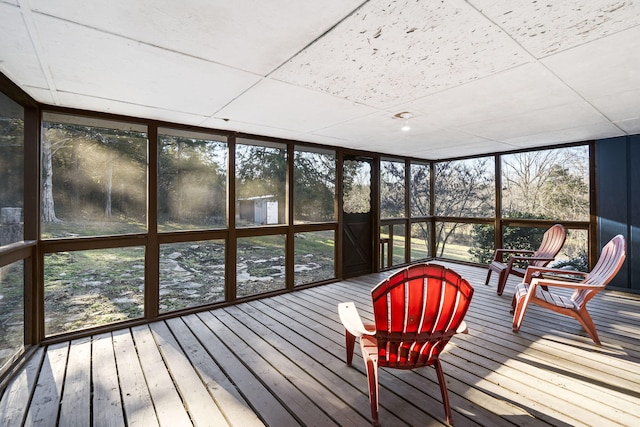 sunroom / solarium featuring a drop ceiling