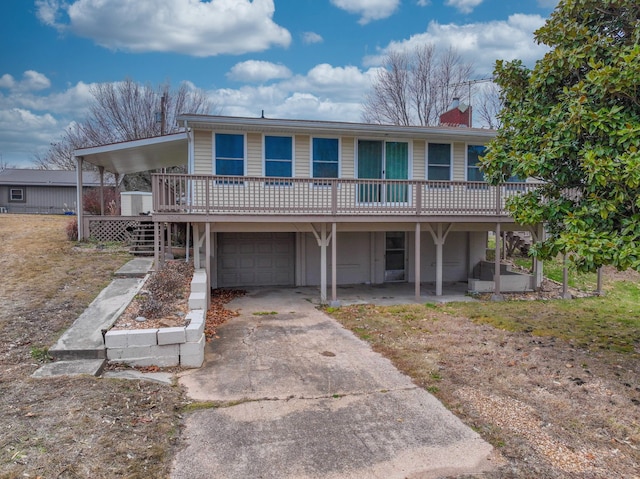 view of front of house featuring a wooden deck and a garage