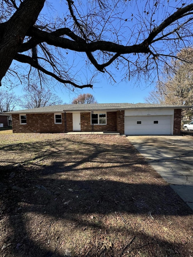 ranch-style house featuring a garage