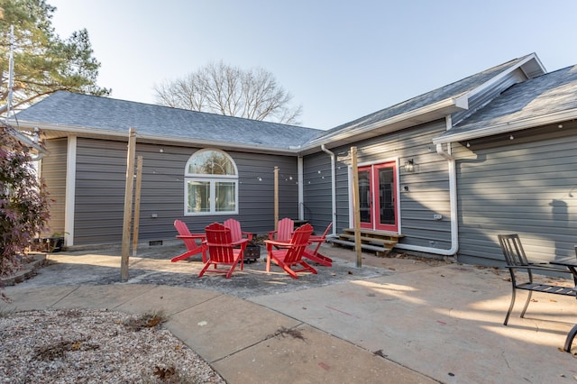 back of property with a patio