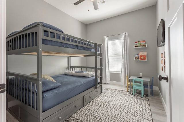 bedroom featuring ceiling fan and light hardwood / wood-style flooring