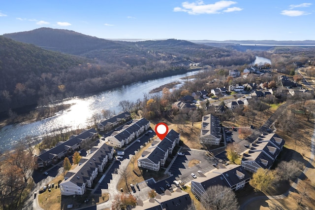 drone / aerial view featuring a water and mountain view