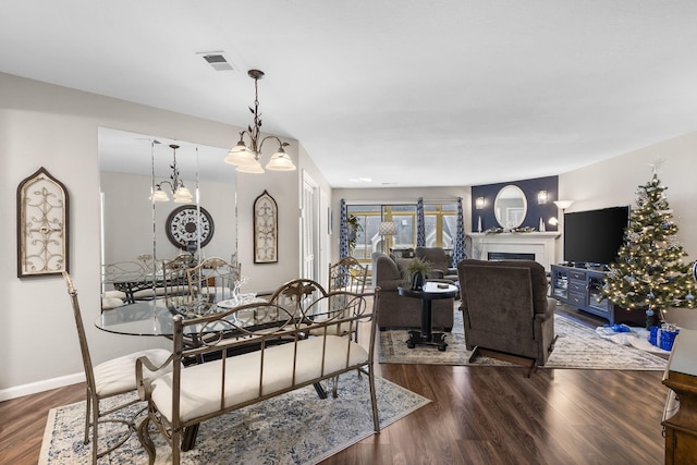 dining room featuring a notable chandelier and wood-type flooring