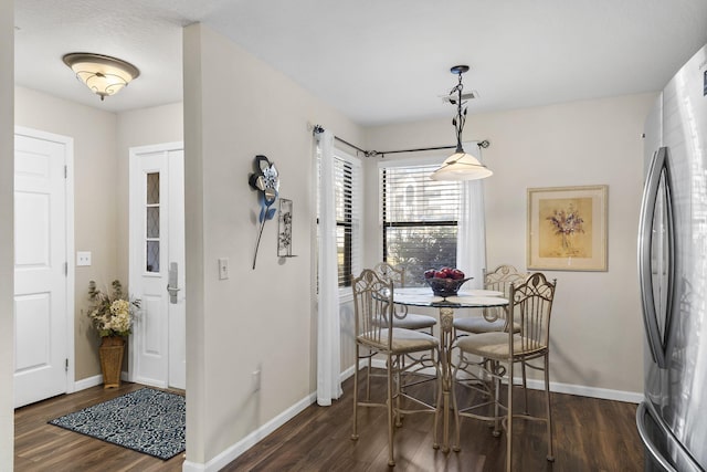 dining area featuring dark hardwood / wood-style floors