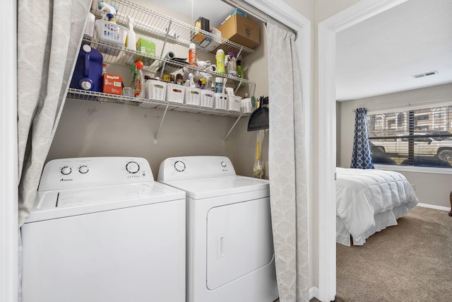 clothes washing area featuring carpet flooring and independent washer and dryer