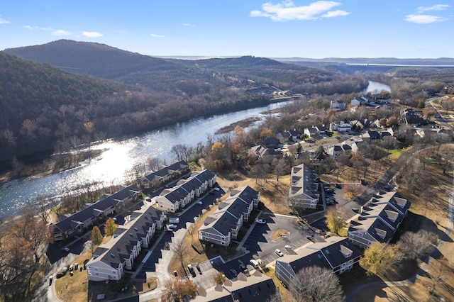 birds eye view of property with a water and mountain view