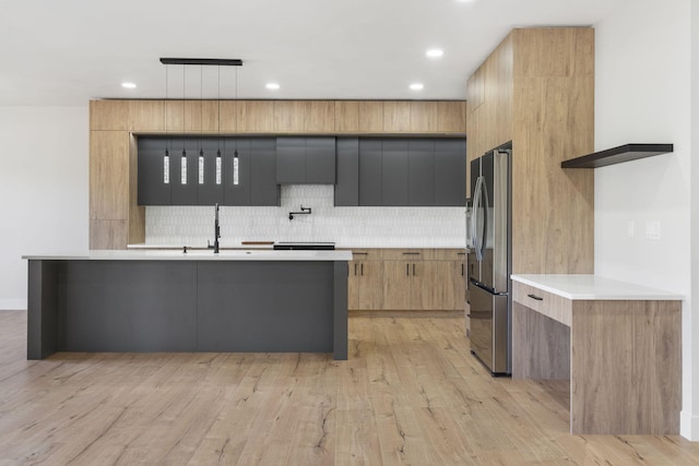 252 Hickory Hills Blvd, Springfield, MO 65802 - kitchen featuring light countertops, tasteful backsplash, stainless steel fridge with ice dispenser, and modern cabinets