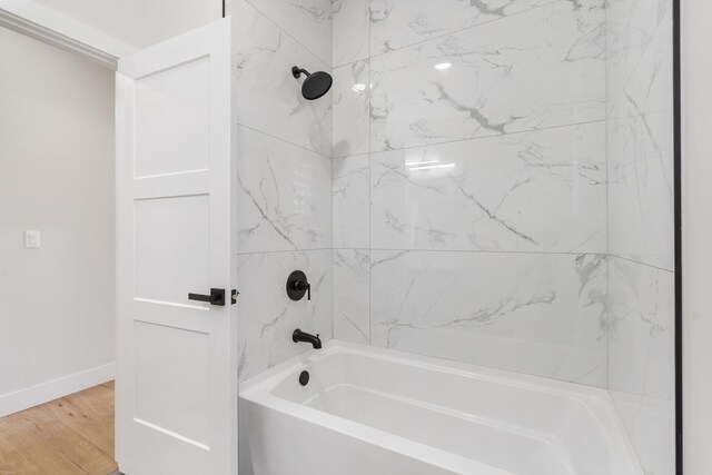252 Hickory Hills Blvd, Springfield, MO 65802 - bathroom featuring baseboards, wood finished floors, and shower / tub combination