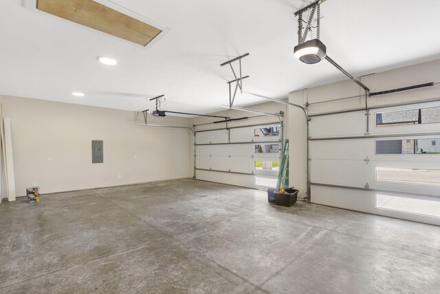 252 Hickory Hills Blvd, Springfield, MO 65802 - garage featuring a garage door opener, electric panel, and recessed lighting