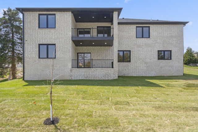 252 Hickory Hills Blvd, Springfield, MO 65802 - back of property with a lawn, brick siding, and a balcony