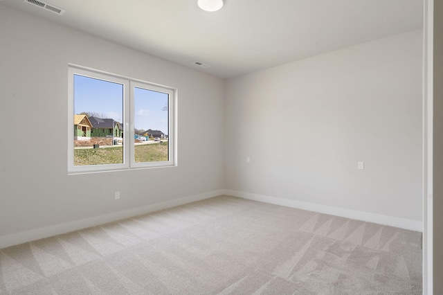 252 Hickory Hills Blvd, Springfield, MO 65802 - spare room featuring light colored carpet, baseboards, and visible vents