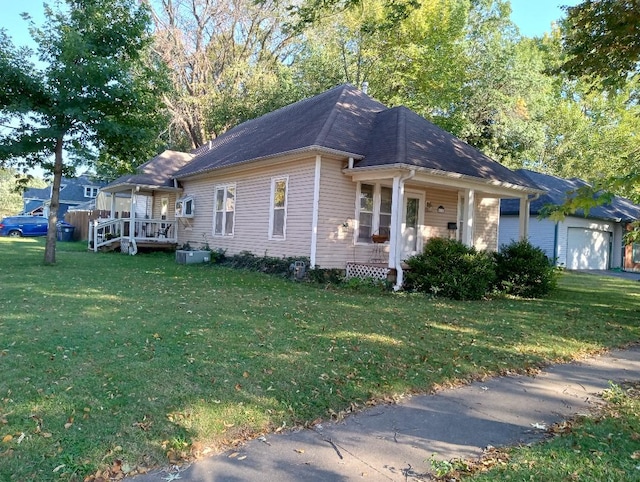 view of front facade with a front lawn, a porch, and a garage