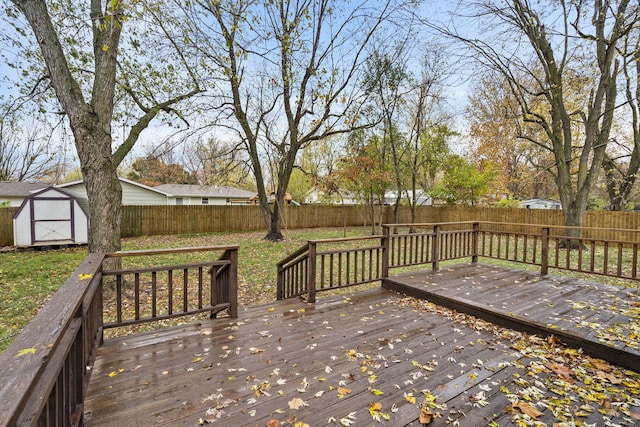 wooden terrace featuring a storage unit