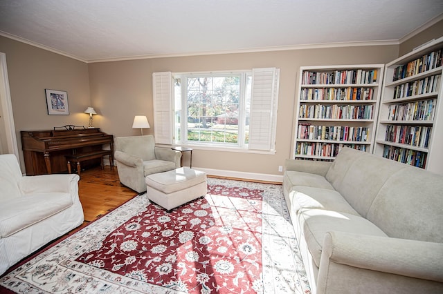 living room with hardwood / wood-style flooring and crown molding