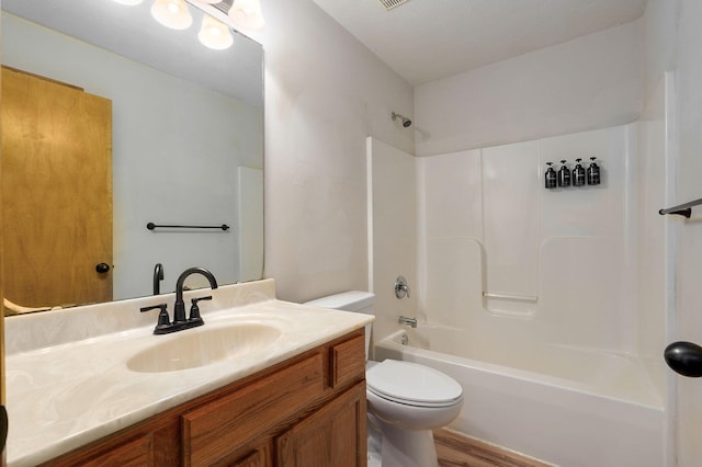 full bathroom featuring vanity, hardwood / wood-style flooring, toilet, and shower / bathtub combination