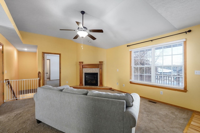 living room with a fireplace, wood-type flooring, ceiling fan, and lofted ceiling