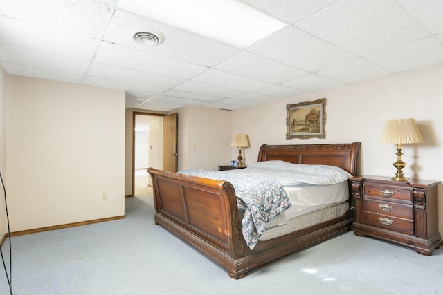 bedroom featuring visible vents, a paneled ceiling, carpet, and baseboards