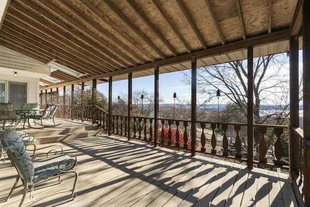 wooden deck with outdoor dining area