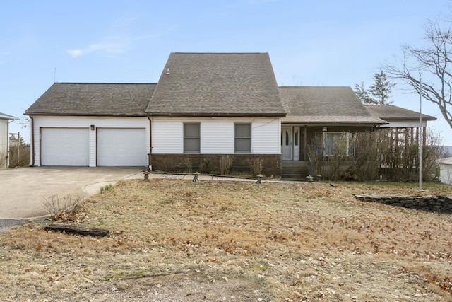 view of front of home featuring brick siding, an attached garage, concrete driveway, and roof with shingles