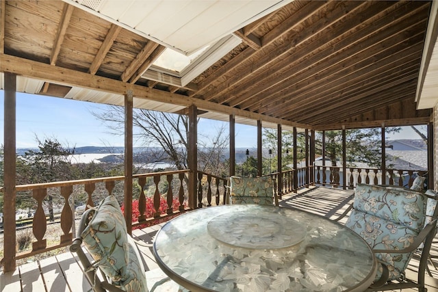 sunroom featuring lofted ceiling