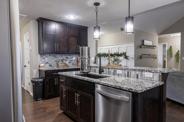 kitchen featuring a center island with sink, sink, hanging light fixtures, stainless steel dishwasher, and dark hardwood / wood-style flooring