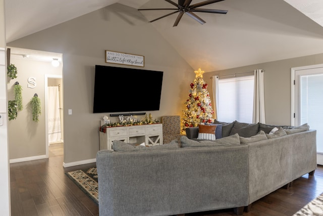 living room featuring ceiling fan, dark wood-type flooring, and high vaulted ceiling