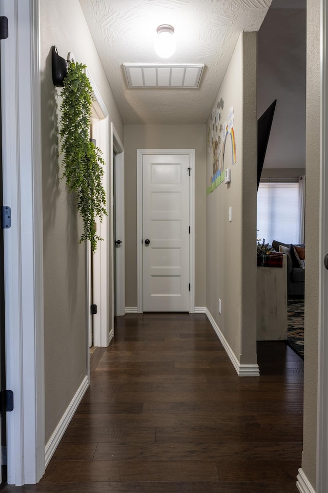 hall with dark wood-type flooring