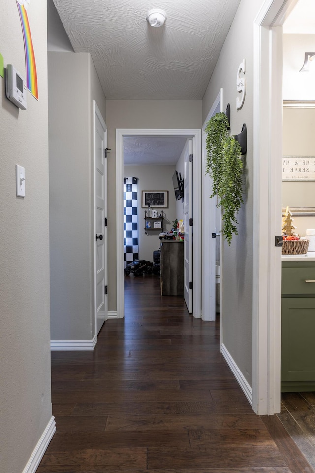 hallway with dark hardwood / wood-style floors