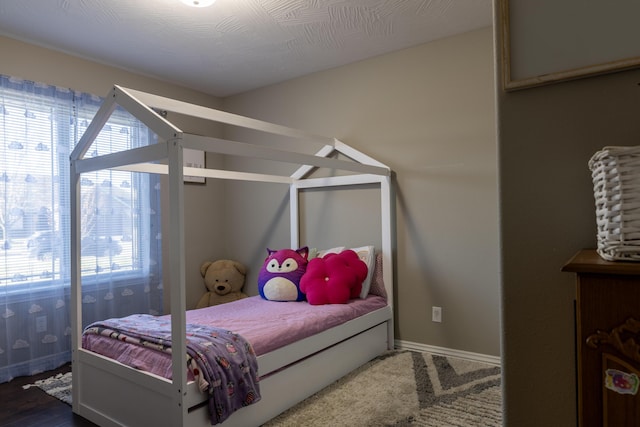 bedroom featuring dark hardwood / wood-style flooring