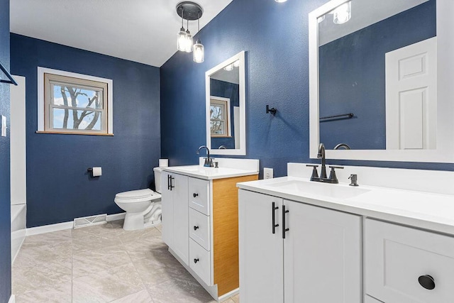 bathroom with vanity and toilet