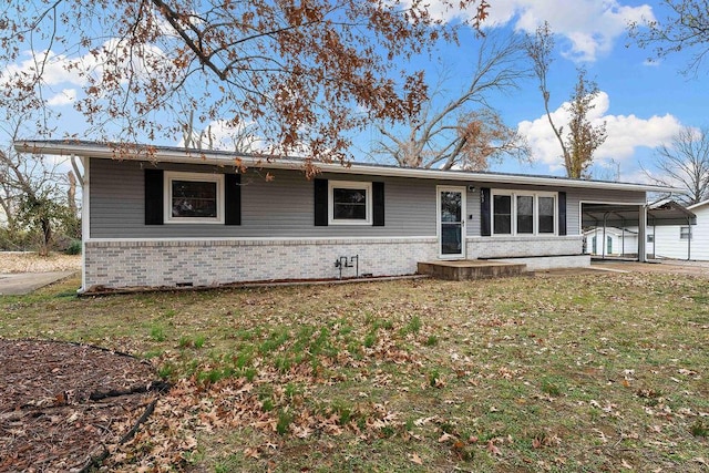 single story home featuring a front lawn and a carport