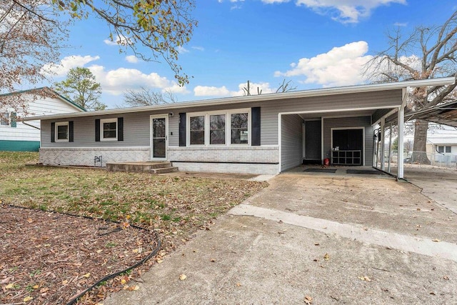 ranch-style house featuring a carport