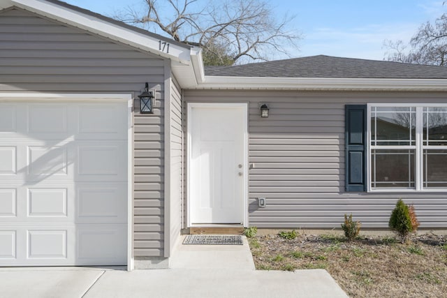 property entrance with a garage