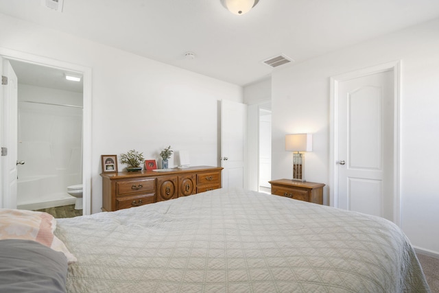 bedroom with ensuite bathroom and a closet