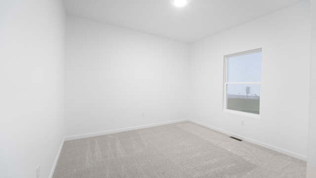 unfurnished room featuring carpet flooring