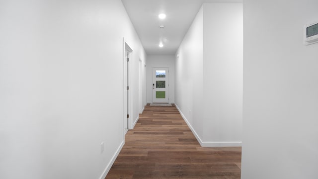 corridor with dark wood-type flooring