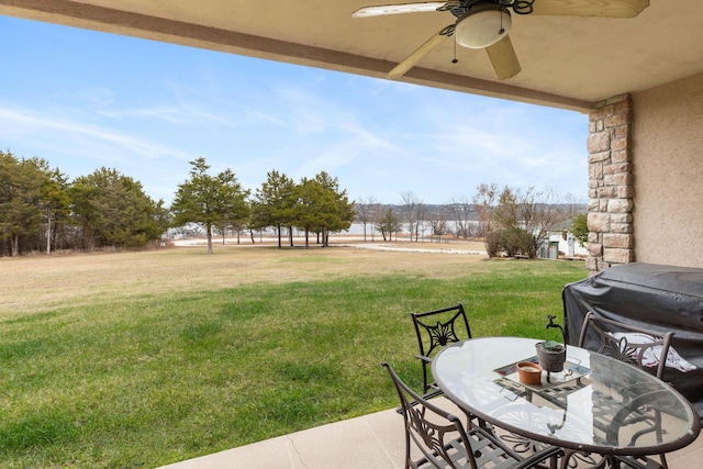 view of yard featuring ceiling fan