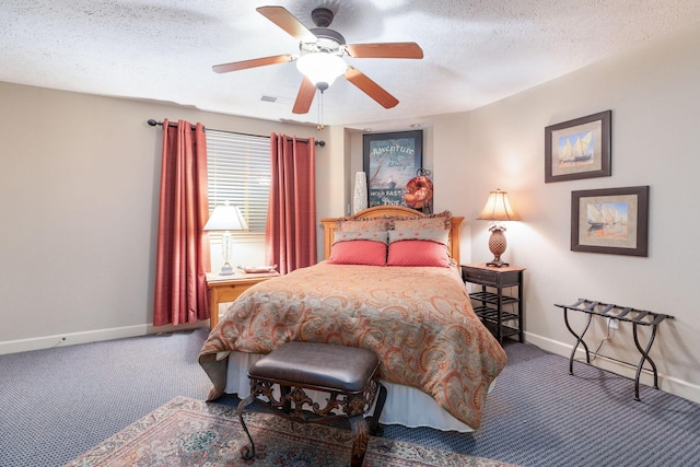 carpeted bedroom with a textured ceiling and ceiling fan