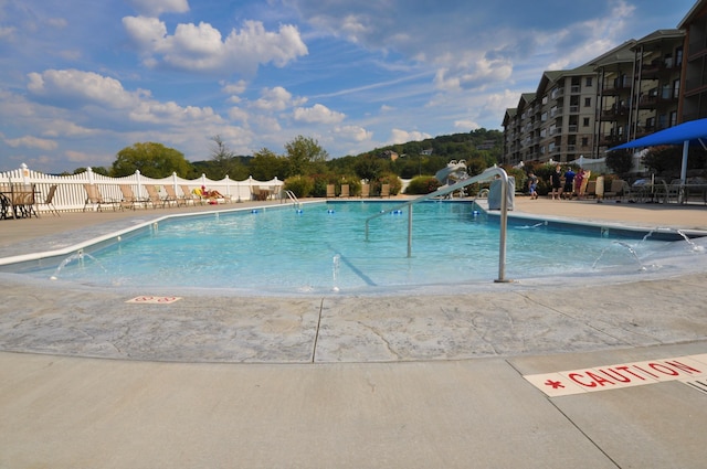 view of swimming pool featuring a patio