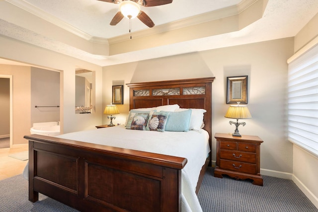 bedroom featuring carpet, a tray ceiling, ceiling fan, and crown molding