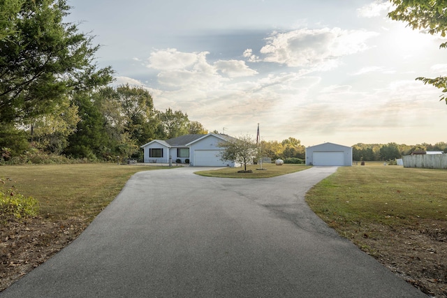 view of front of house featuring a front yard and a garage