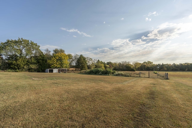 view of yard with a rural view