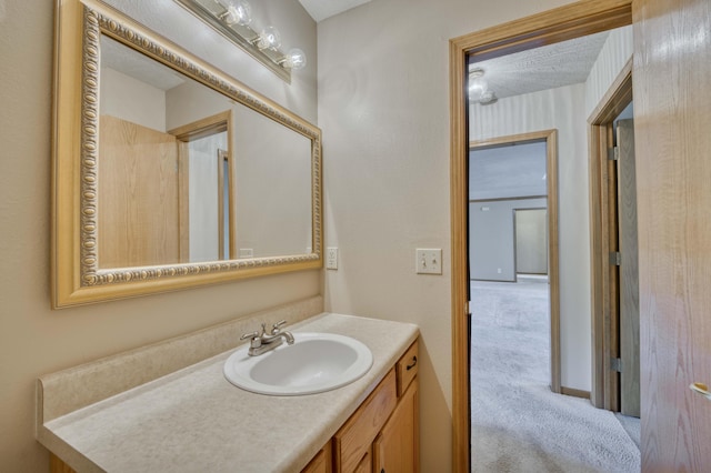 bathroom featuring vanity and a textured ceiling