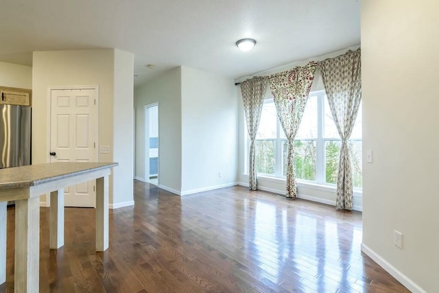 spare room with dark hardwood / wood-style floors