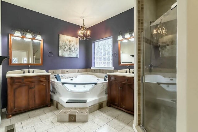 bathroom featuring independent shower and bath, tile patterned flooring, vanity, and a chandelier