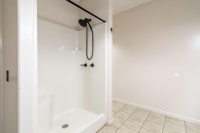 bathroom featuring tile patterned floors and walk in shower