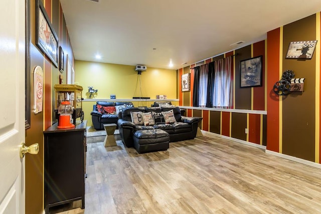 cinema room featuring light hardwood / wood-style flooring