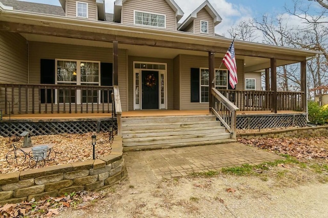 doorway to property with a porch