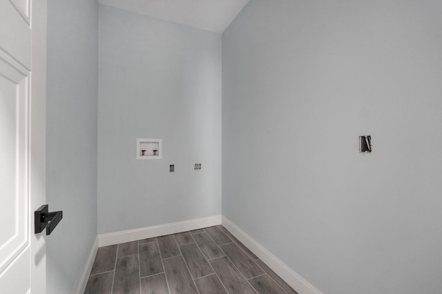 clothes washing area with dark hardwood / wood-style flooring and hookup for a washing machine