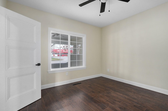 unfurnished room featuring dark hardwood / wood-style flooring and ceiling fan